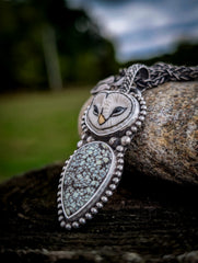 Detailed side angle of owl carving, New Lander turquoise and sterling silver beadwork