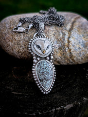Hand-carved porcelain owl pendant with New Lander turquoise and 20-inch wheat chain on stone